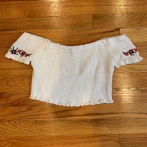 white ruffle of the shoulder crop top